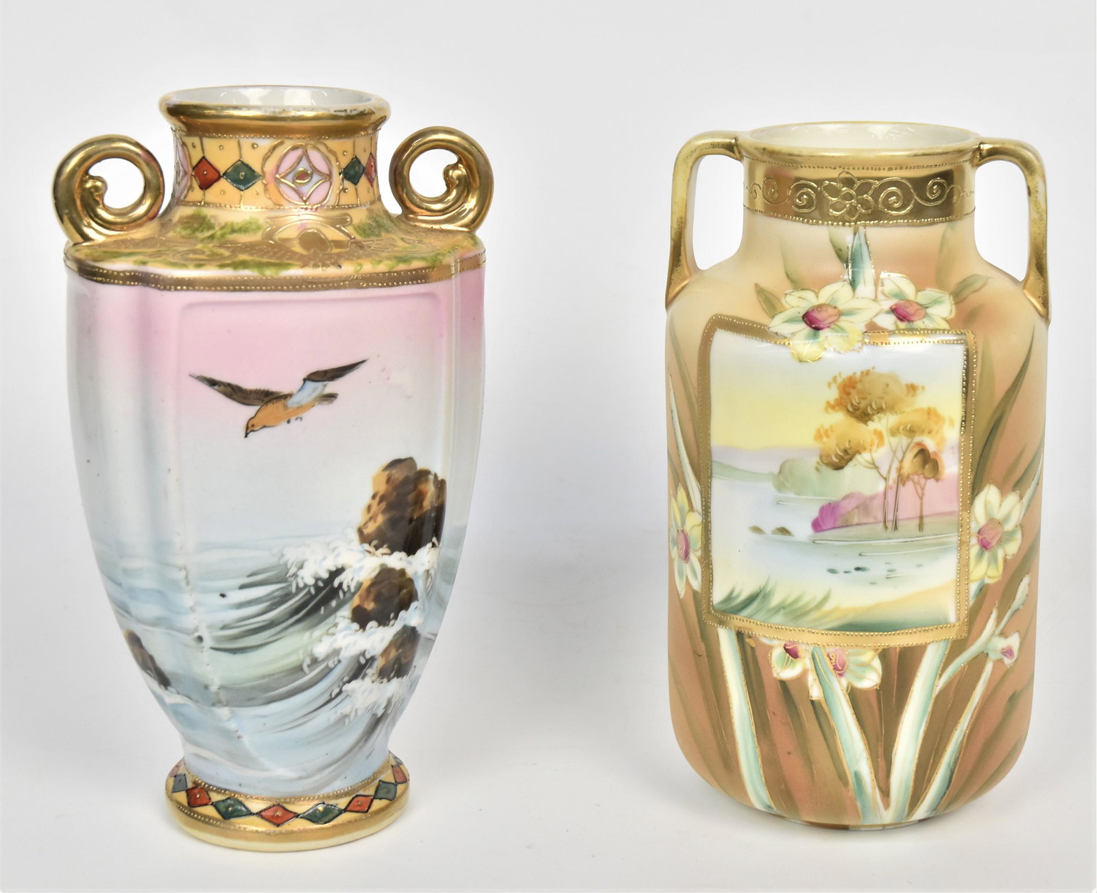 Two Nippon Handled Vases: A 8" with seagull & costal scene with raised gold trim, a 7 1/2" with landscape & daffodils, attractive . Good condition.