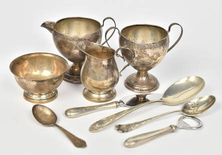 Nine Sterling Items: Creamer & sugar, birth spoon, 2 serving spoons, 2 sugar bowls, dessert, server & bottle opener. Good Condition. 9.20 weight troy oz on non weighted items, weighted items include cream and sugar, cake