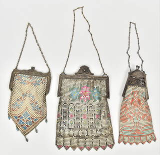 Three Victorian Ladies Mesh Evening Purses: One has open work metal top, Largest is 7 1/2" x 4 3/4" W. Good condition to all.