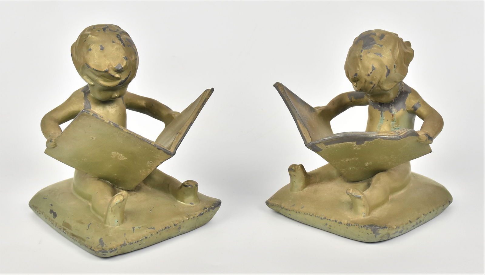 Pair Frank Art Metal Bookends: Of children readers 6 1/4" x 5" across. Condition wear to finish.