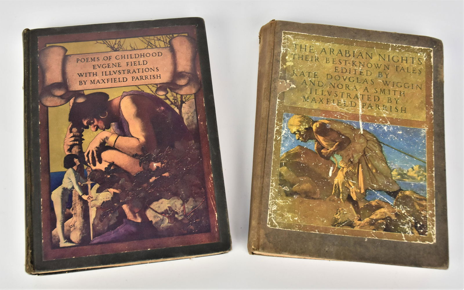 Two Maxfield Parrish Books: Including Poems of Childhood with illustrations 9 1/2 H x 7 1/2 W copyright 1904 fair condition, plus " The Arabian Nights copyright 1909 , scratches to front cover, 9 1/2 H x 7 1/2 W.