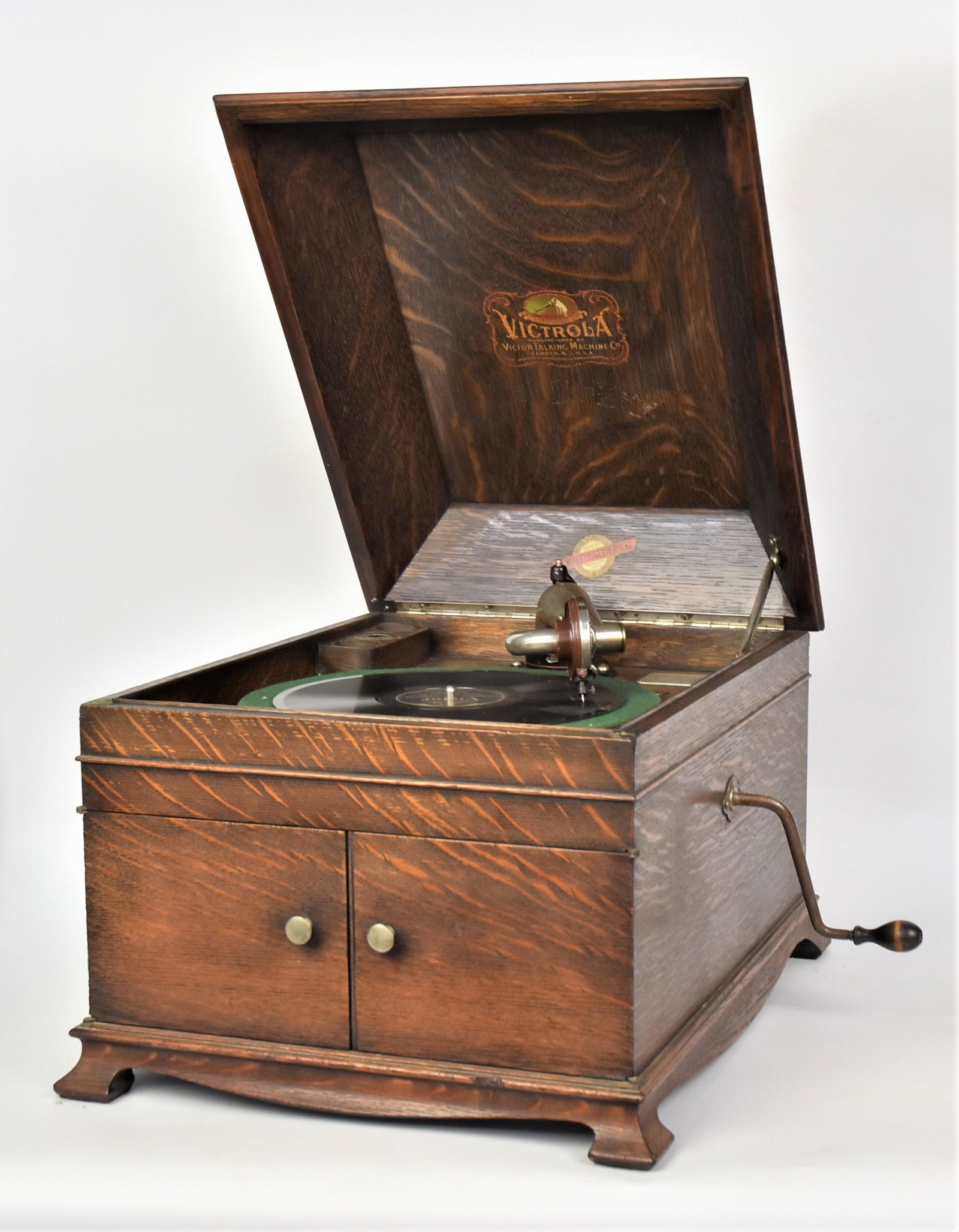 Victrola Disc Phonograph: Oak case with all parts and decals, extra needles, 20 1/2 x 17 x 14" high. Condition Fine.