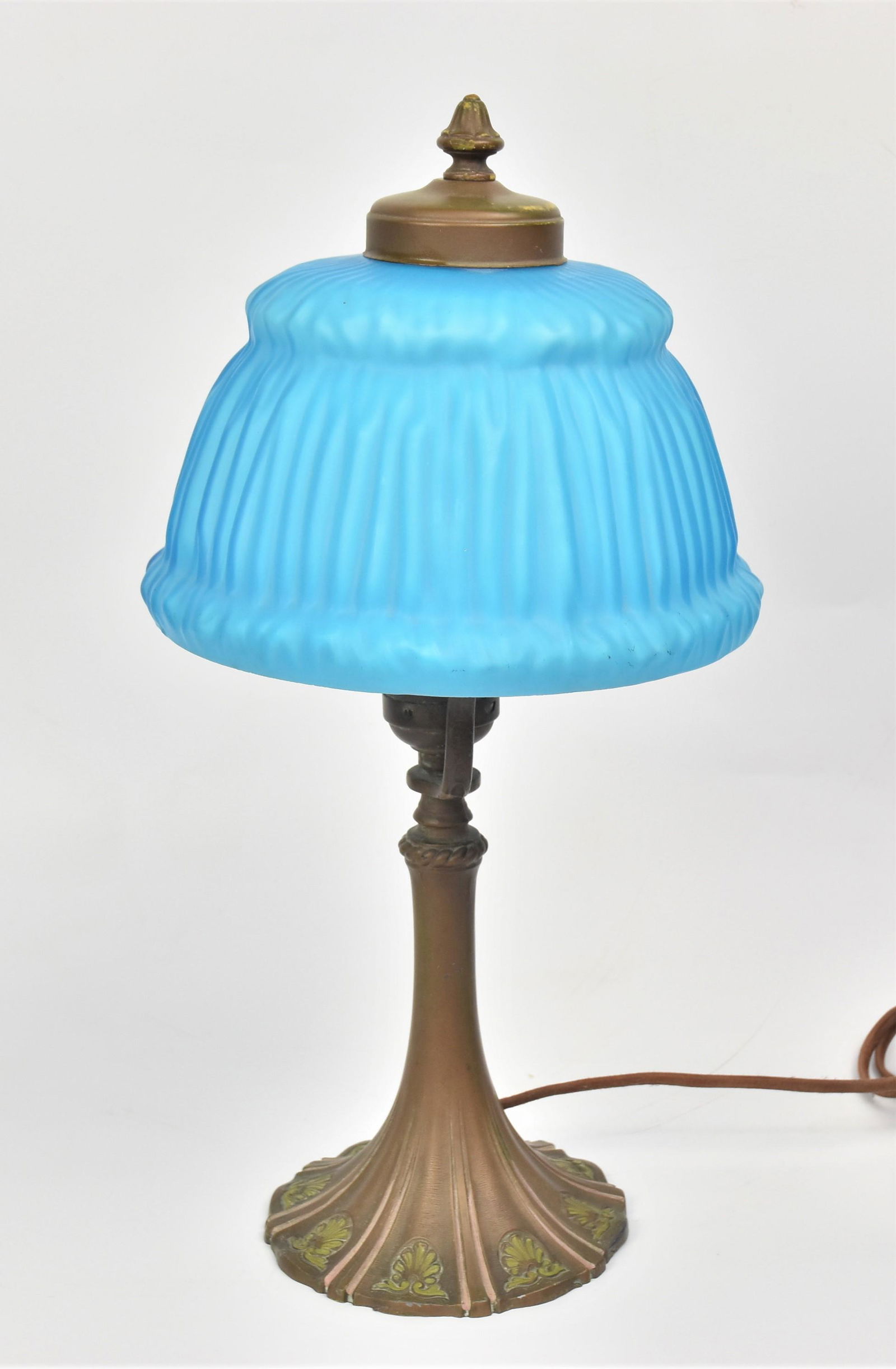 Satin Glass Desk Lamp: Linen fold 7 1/2" diameter blue satin glass shade on bronzed metal base with shell motif around base, 15" high. Condition VG.
