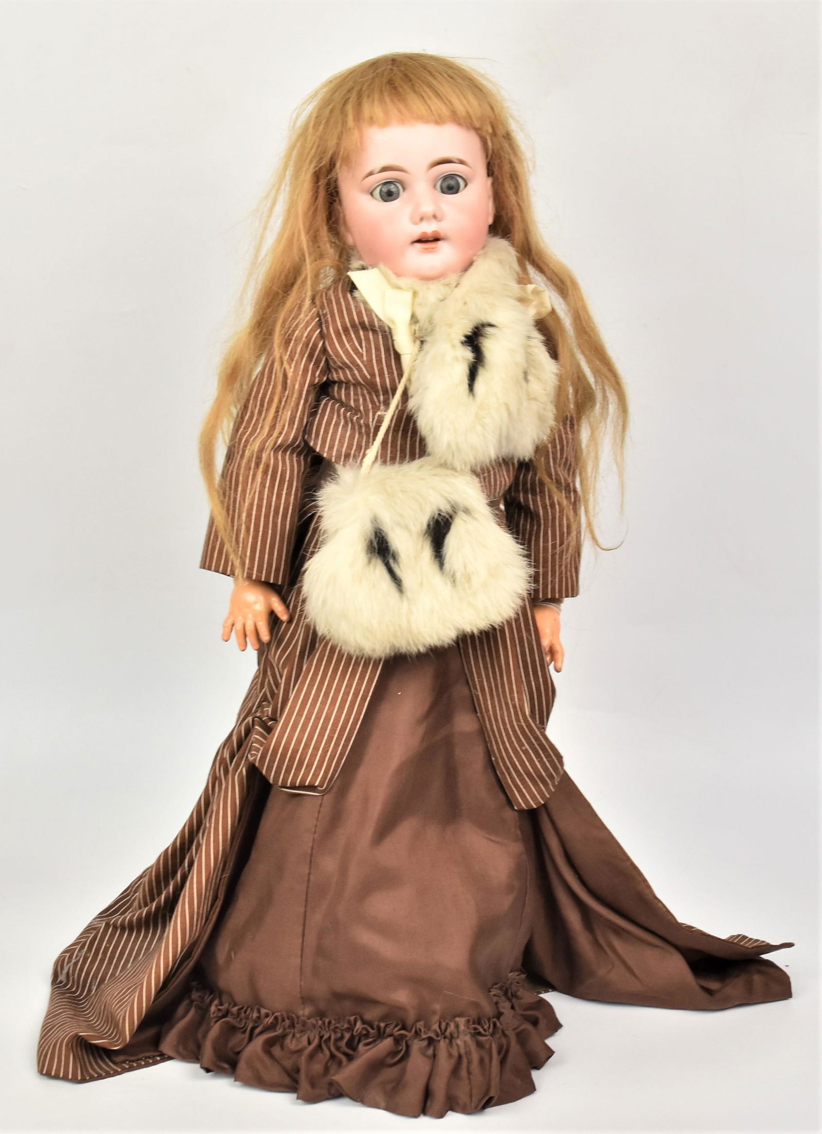 A&M Bisque Socket Head Doll: Marked on back of neck AM 11 Dep. Made In Germany, with gray sleep glass eyes, open mouth replaced blonde wig, jointed composition body in newer outfit with fur and umbrella, 25" tall. Condition as ab
