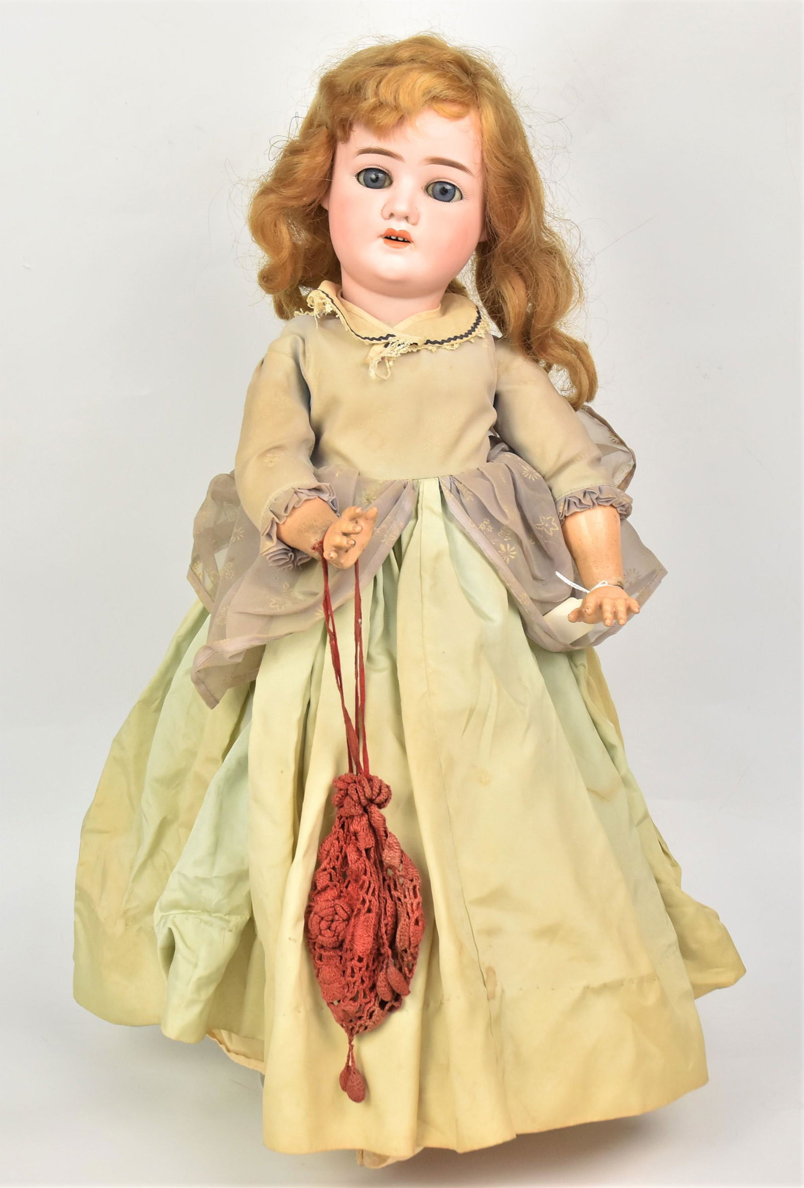Schoenau Hoffmeister German Bisque Head Doll: Measures 26" H bisque socket head with blue sleep eyes, # 5500 and SH star mark, on jointed composition body, lower leg missing otherwise good condition.