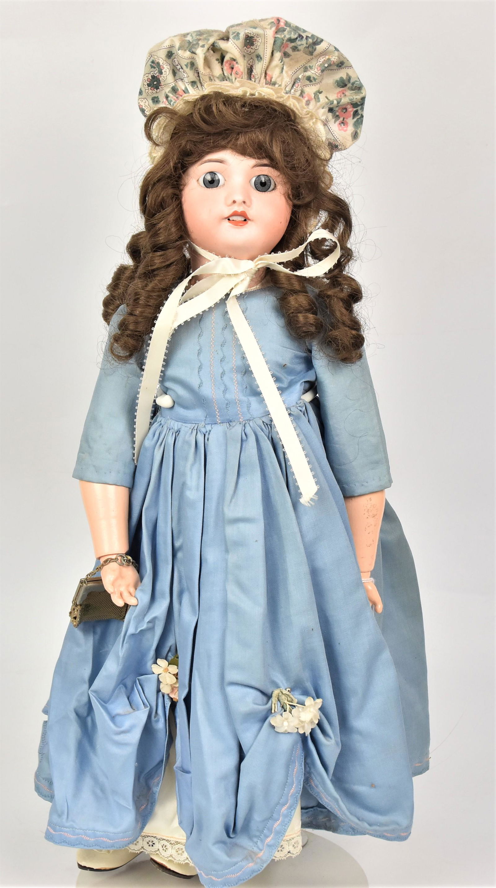 S.F.B.J. Bisque Socket Head Doll: Marked on back of neck D/S.F.B.J./50/Paris, with fixed gray glass eyes, open mouth, new brown wig, outfit and shoes, on jointed composition body with metal mesh purse, 20" tall.