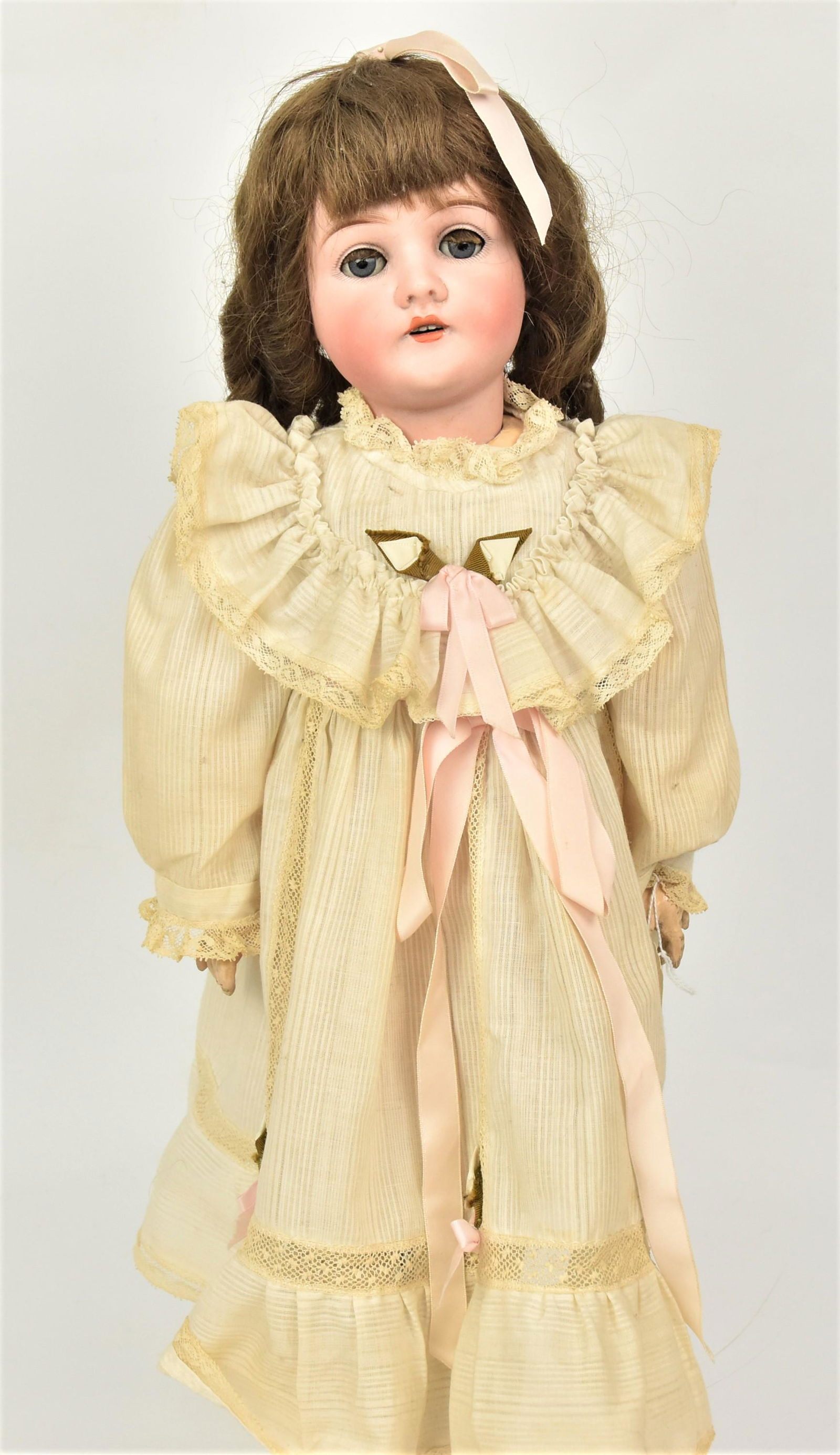 Queen Louise Bisque Socket Head Doll: Marked on back of neck Germany Queen Louise, gray glass sleep eyes, open mouth, older period outfit, new brown wig and shoes, on jointed composition body, 22" tall. Condition as above, else VG.