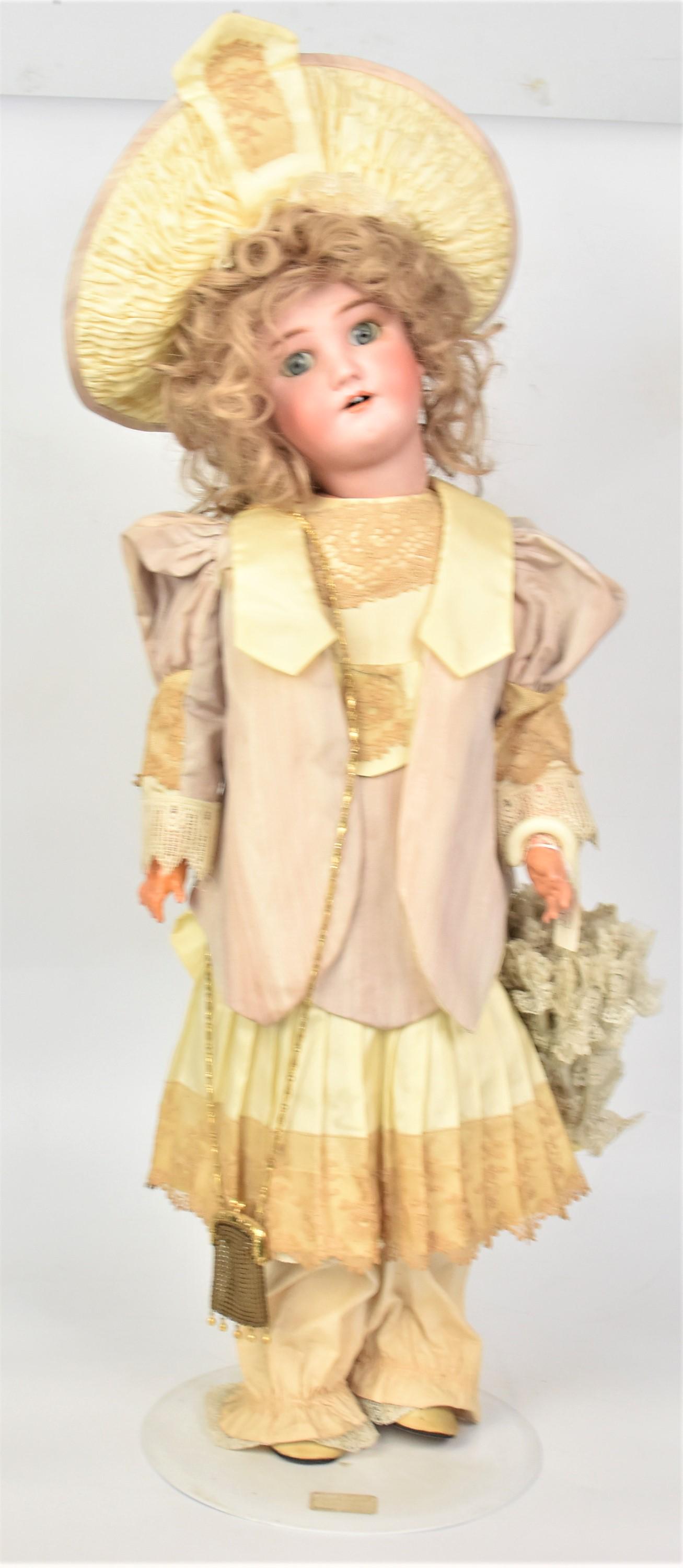 German Bisque Socket Head Doll: Marked on back of neck Heinrich Handwerk/Simon & Halbig, with gray fixed glass eyes, open mouth pierced ears on jointed composition body in period outfit and new wig with bonnet, new shoes, 28" tall.