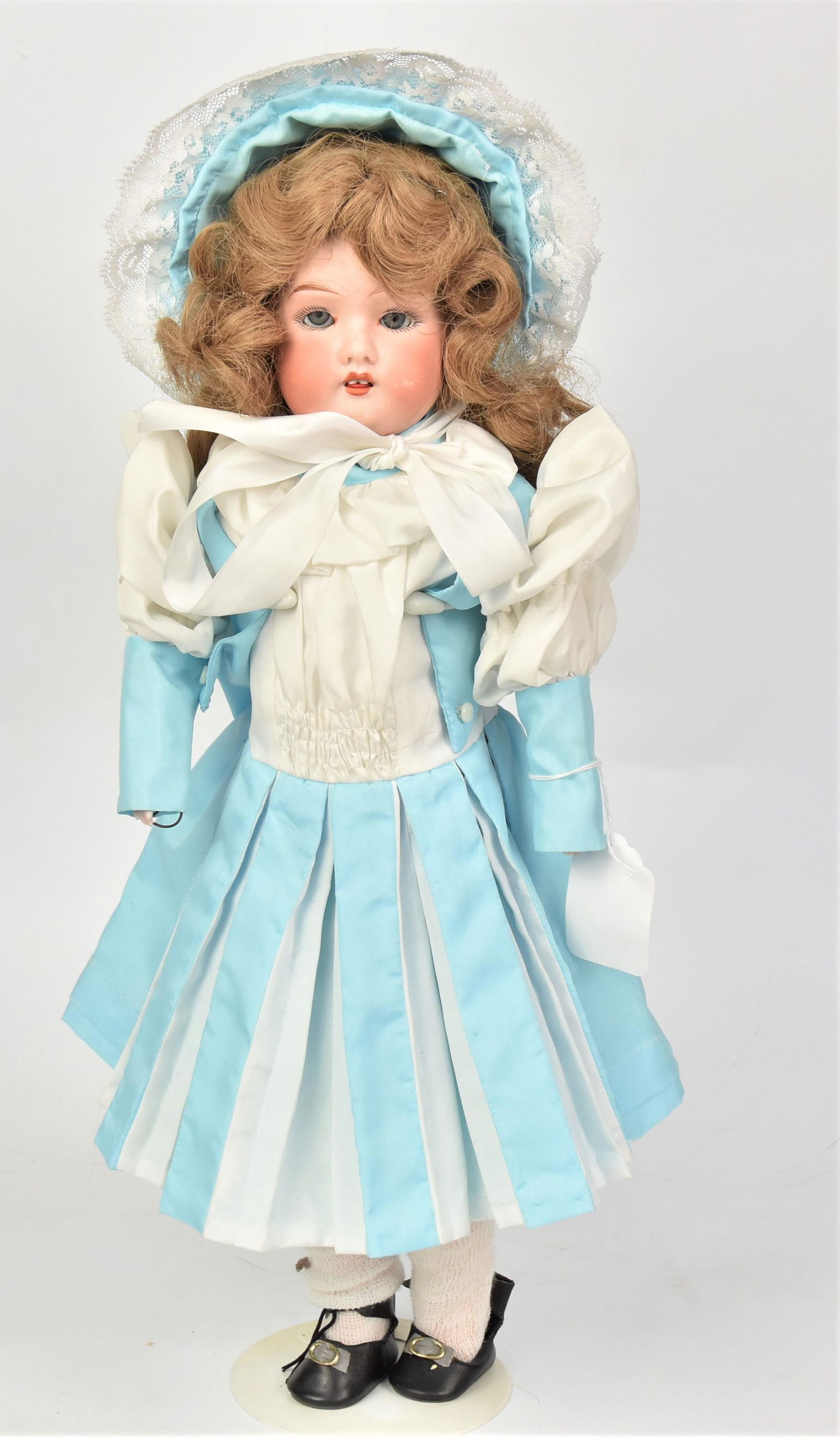 Fulper Bisque Shoulder Plate Doll: Marked as above & S9/Made In U.S.A. with fixed gray glass eyes, new wig & outfit on jointd kid body with bisque lower arms/hands and composition lower legs/feet, 19" tall.