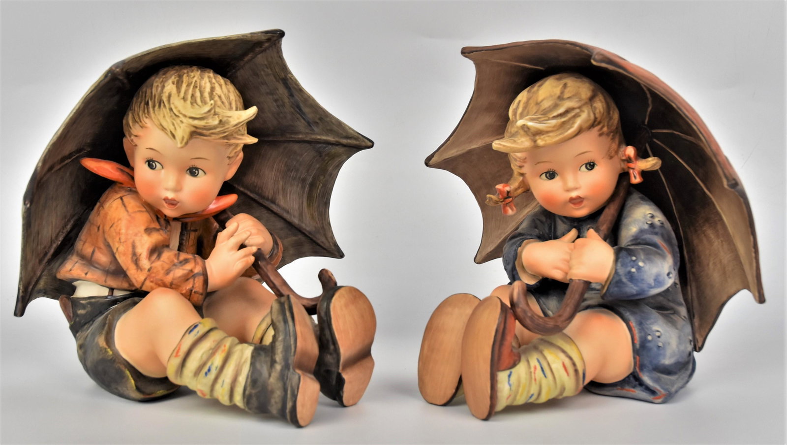 Pair of Large 8" Hummel Figurines: Incliding #152/IIA, #152/IIB, umbrella girl and boy, TMK-6 Marked. Both in good condition