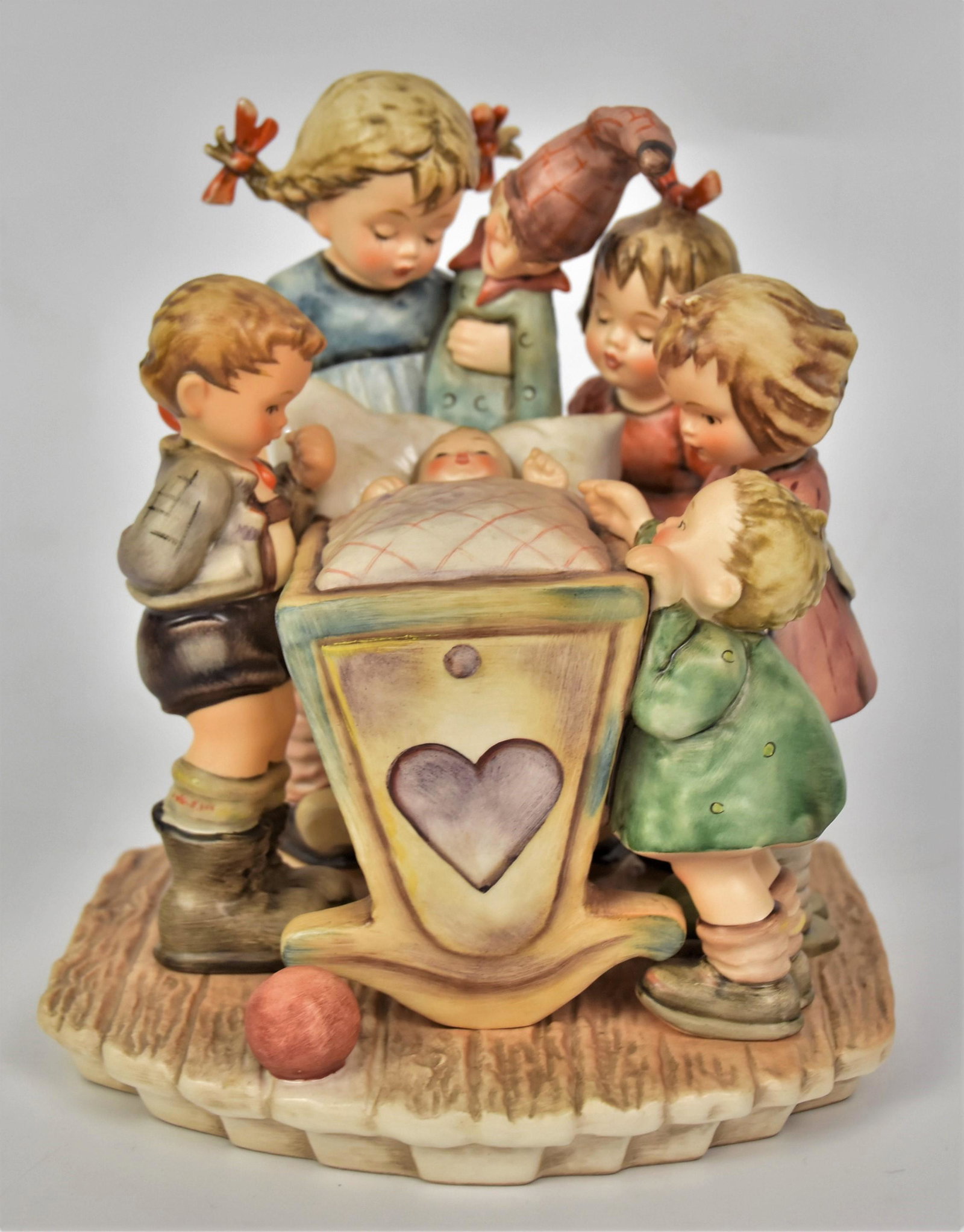 Large Rock-a-Bye Hummel Figurine: Measures 7 3/4"H X 6 1/4" W, TKM-7 mark 1994 Century collection mark. Good condition.