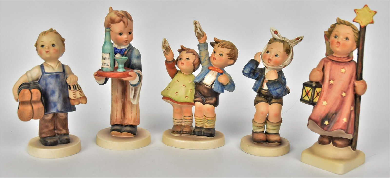 Five Hummel Figurines: Including #343 TMK-6, #143/0 TMK-3, #217 TMK-4, #133/0 TMK 5, #154/0 TMK-6, tallest is 6 1/2". All good condition.