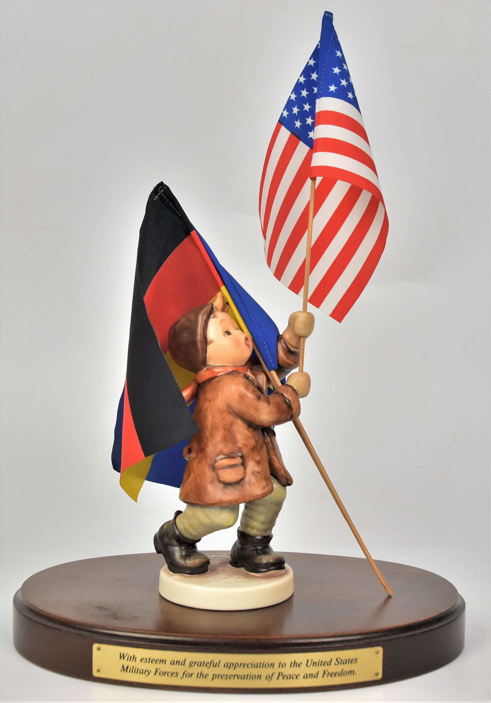 Call To Glory Hummel Figurine: 12" to top of flag on wood base #739/I TMK-7, FROM 1994. Good condition.