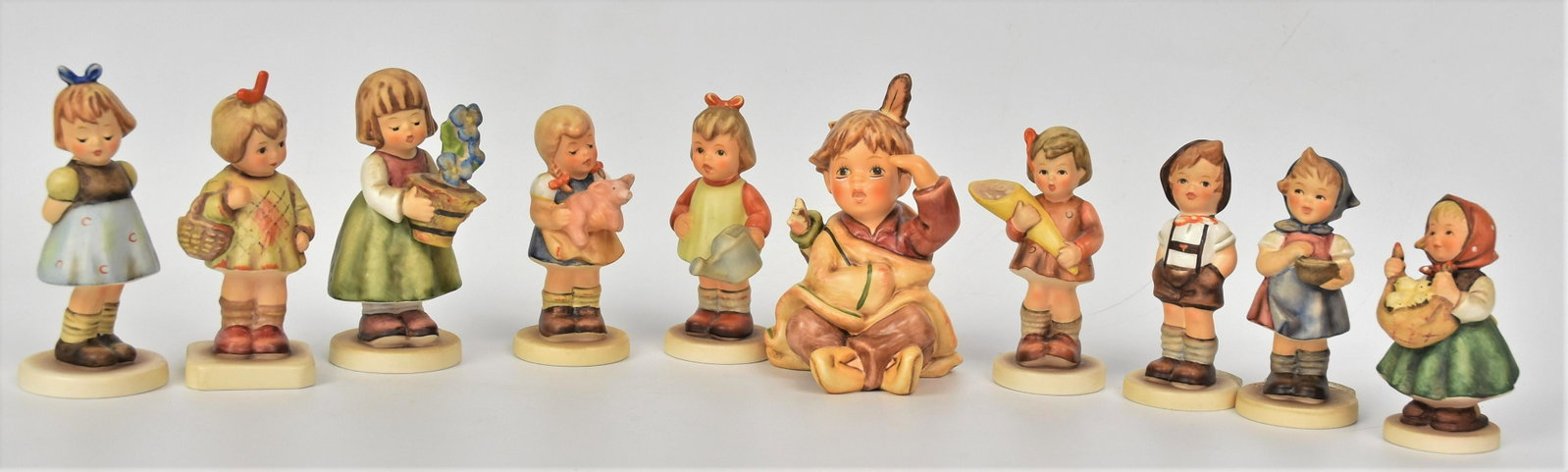 Ten Small Collectors Club Hummel Figurines: Tallest is 4 1/4", includes #549 TMK-7, #629 TMK-7, #630 TMK-7, #385 4/0 TMK-6, #206 TMK-8, #479 TMK-7, #341 TMK-7 Artist signed and dated, #493 TMK-7, #729 TMK-7, #2052 TMK-7. All good condition..