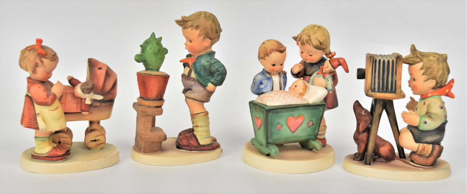 Four Hummel Figurines: Includes #314 TMK-5, #333 TMK-7, #178 TMK-5, #67 TMK-3 , tallest is 6" . All good condition.