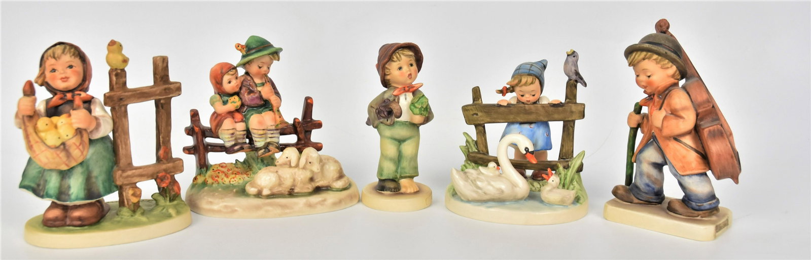 Five Hummel Figurines: Includes #99 TMK-3, #385 TMK-5, #89/I TMK-5, #344 TMK-5, #274 TMK-5, tallest is 5 1/4". All good condition.