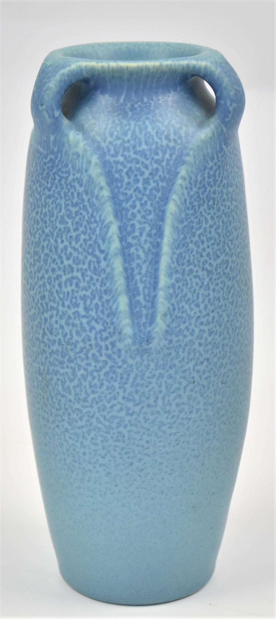 Rookwood Pottery Arts & Crafts Vase: Mottled matt blue with leaf form handles, marked with Rookwood symbol, dated 1916, shape number 2126 with black painted 2816, designed by Albert C. Munson, 3" diameter x 8 1/2" high. Condition Fine.