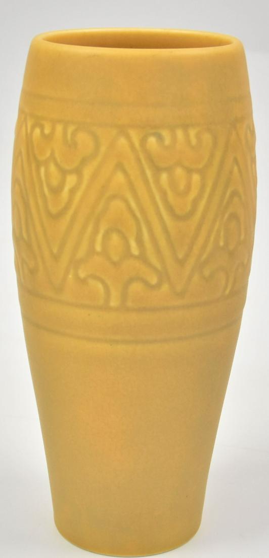Rookwood Pottery Arts & Crafts Vase: Molded stylized floral design in matt glaze marked with Rookwood symbol, dated 1926, shape number 2864, designed by Albert C. Munson, 3 1/4" diameter x 8" high. Condition Fine.