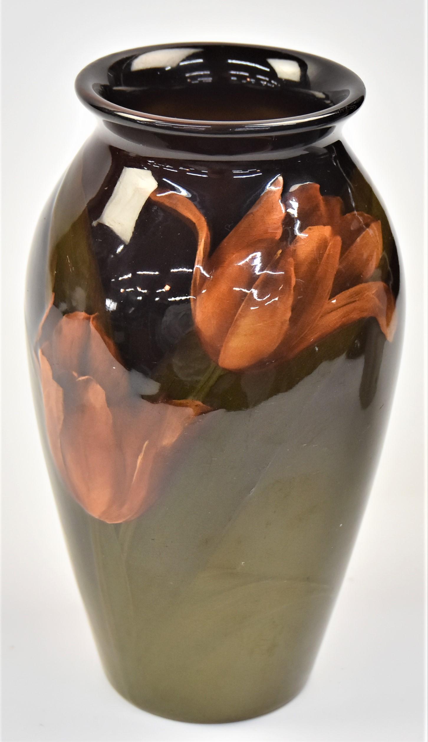Carl Schmidt Rookwood Pottery Vase: Standard glaze with tulips,marked with Rookwood symbol, with 12 flames (1898), shape number 568C with incised Carl Schmidt monogram, 3 1/2" diameter x 7" high. Condition Fine.