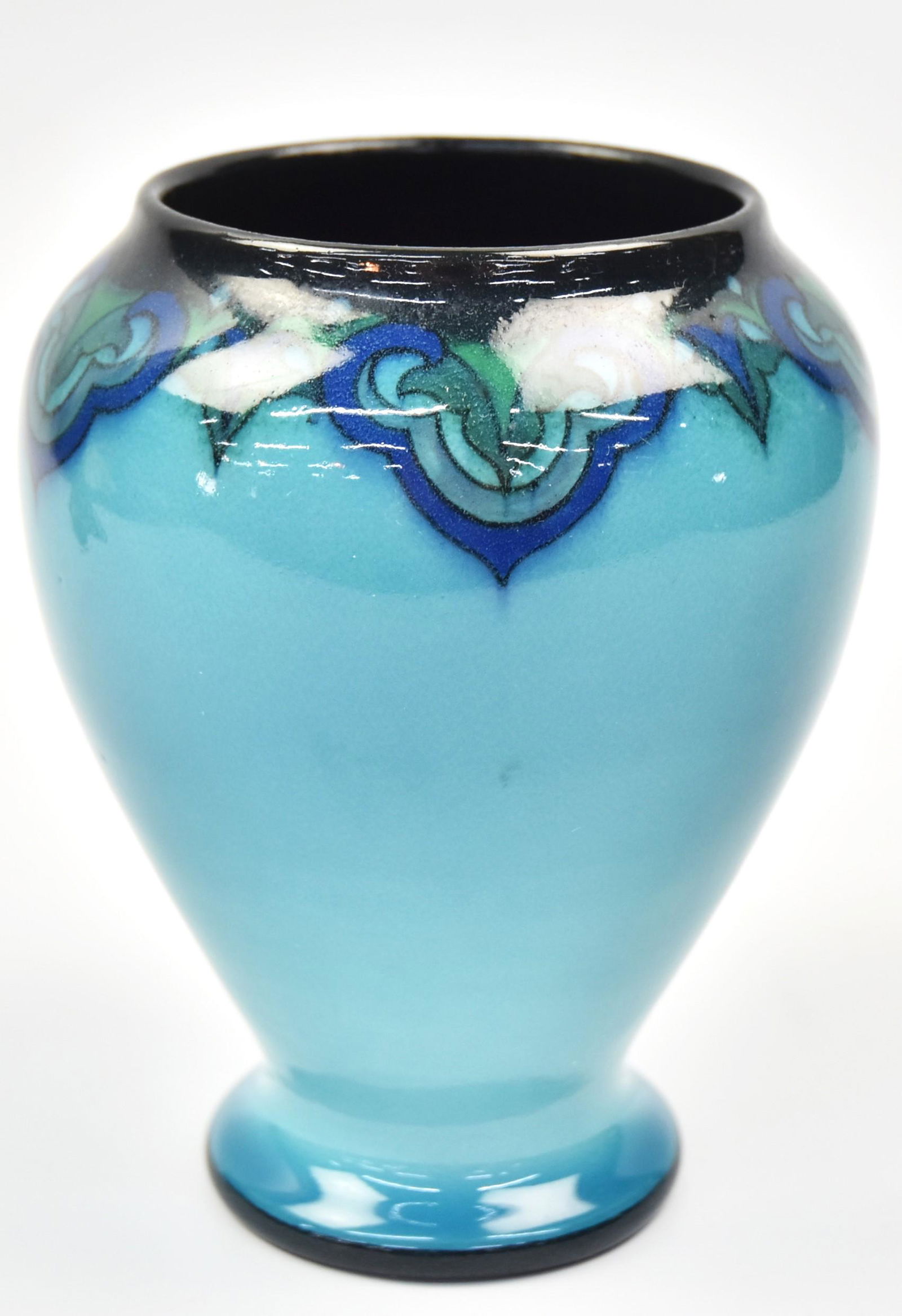 Fine Rookwood Blue Tint Porcelain Vase: By Sara Sax. Date 1917. Shape 1781. artist scrolling design about the shoulder. Measures 6"H. Incised artist monogram. Impressed sideway P for porcelain body. Charming design. Very good condition.