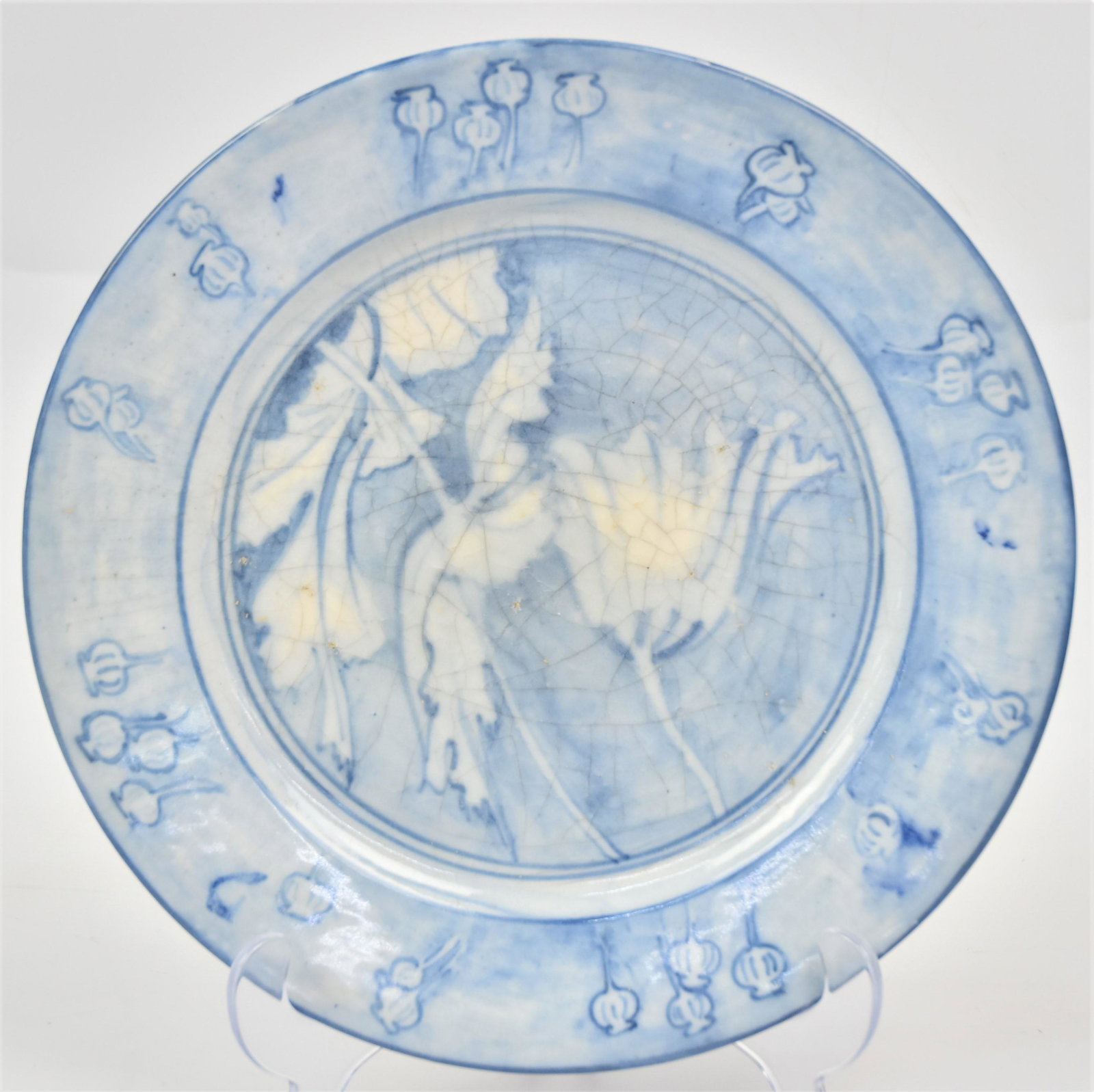 Dedham Pottery Poppy Plate: Marked with incised rabbit mark and blue underglaze marks, 10" diameter. Condition Fine.