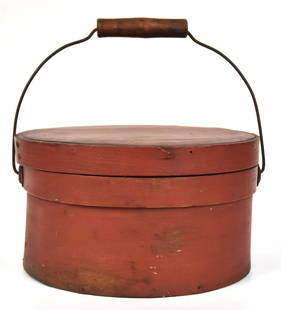 Red Painted Pantry Box: Bent spruce with white pine lid and base in old painted finish with steel wire swing bale handle with turned maple grip, 9 1/2" diameter x5 1/4" high. Condition paint circa 96%, VG.