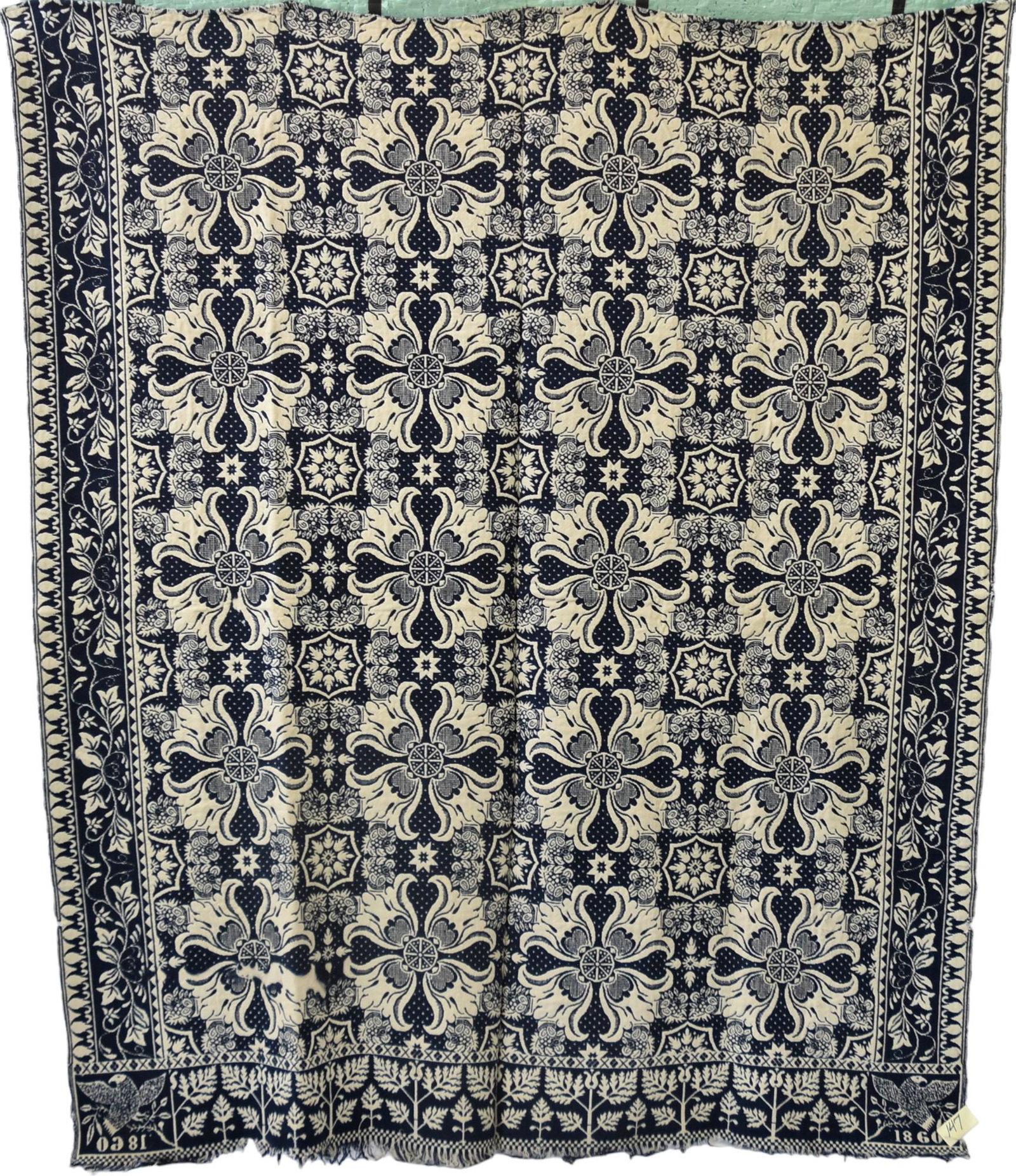 Early Blue and White Coverlette: Dated 1860 with eagles. 72" x 84". Some slight wear to edges otherwise good condition.