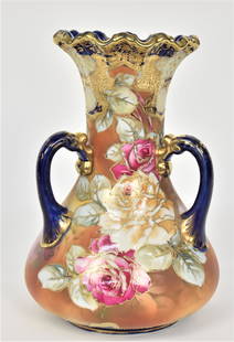 Large Cobalt Blue Dolphin Handled Nippon Vase: Immense pink & yellow roses. Decorative bright gold trim. 12”T. 9”W. Very good condition. Blue mark.