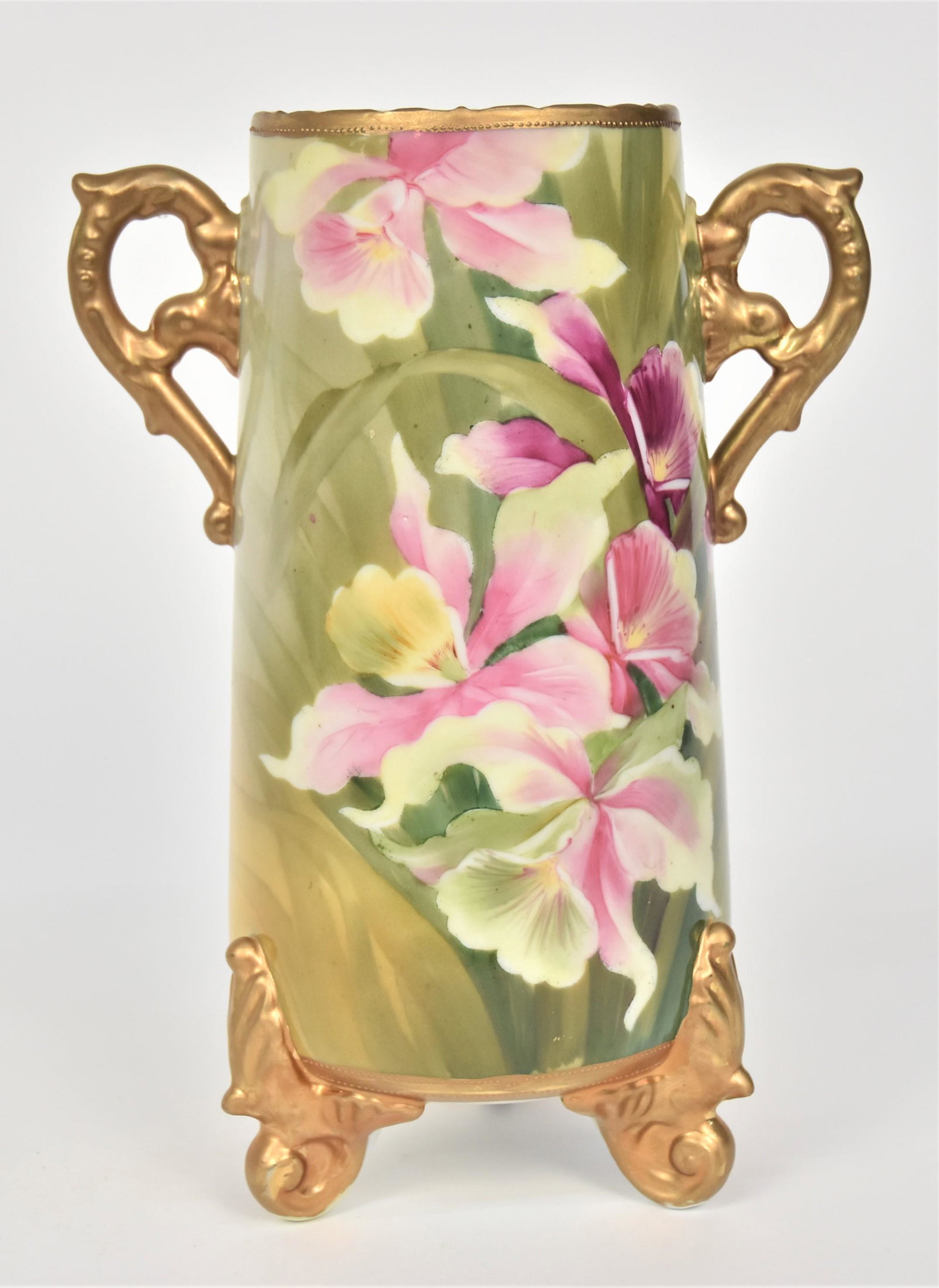 Nippon Orchid Vase: With gold curled dolphin handles & acanthus leaf feet. 9 3/4”T. 7”W With handles. Unfired gold at rim. Green mark.