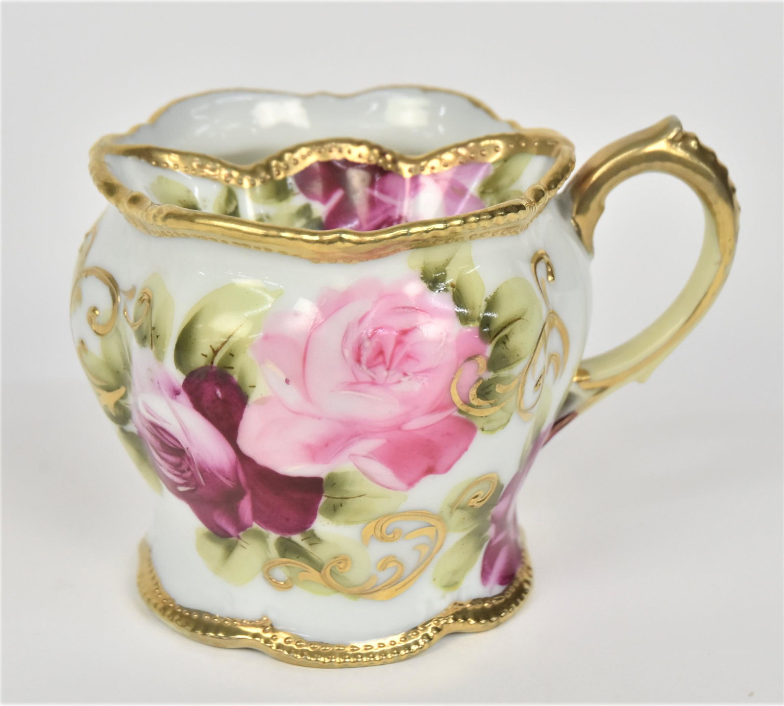 Nippon Shaving Mug: With heirloom roses. Gold on handle & rims. 3 3/8”T. Very good condition. Blue mark.