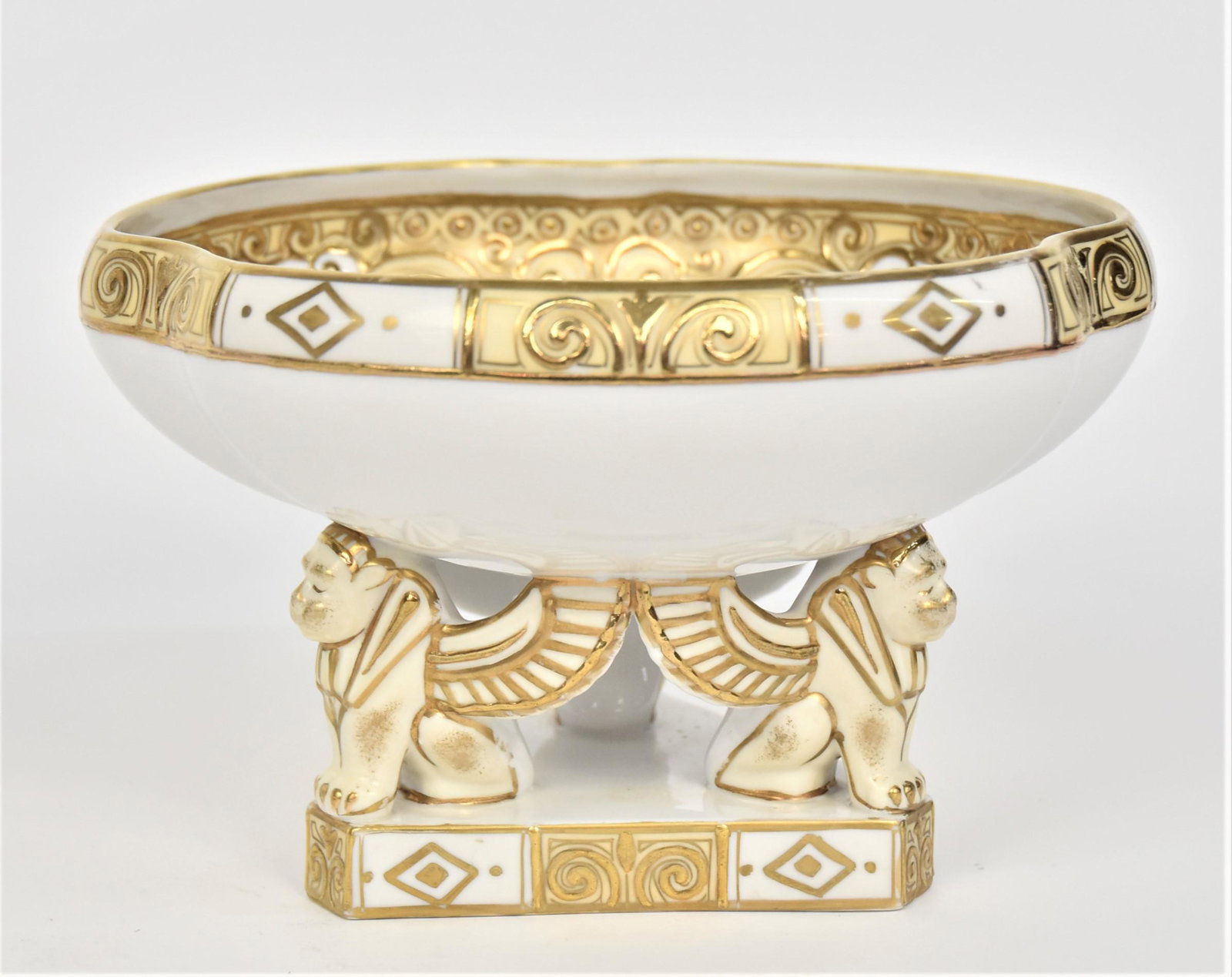 Nippon Griffin Base Compote: Lofting an ornately decorated bowl With heavily gilded exotic flowers & beaded swags. 5”T. 8”D. Very good condition. Green mark.