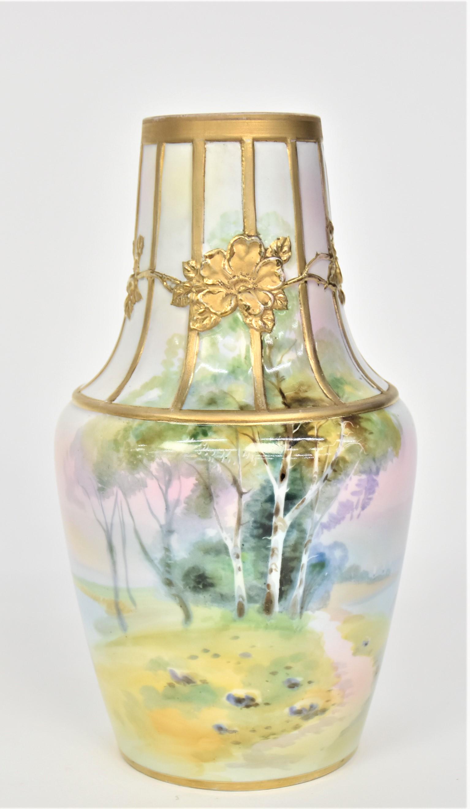 Nippon Molded in Relief Vase: With colorful landscape & relief gold wild roses. 9 1/4”T. 5”W. Very good condition. Green mark.