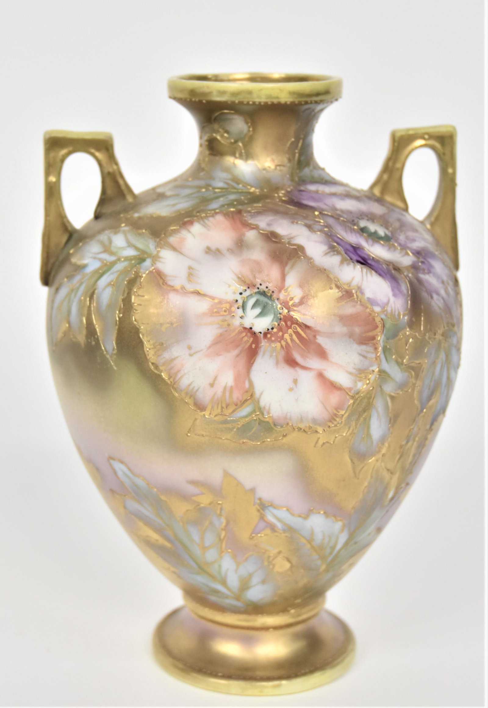 Nippon Pastel Poppy Handled Vase: With a gilt stencil backdrop. 8”T. 5 1/2”W. Very good condition. Green mark.