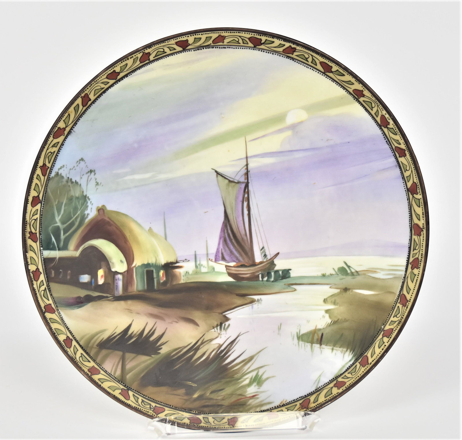Nippon Moonlight Landscape Plaque: With thatch roof houses & a docked sailing vessel. Attractive decorated border. 10”D. Very good condition. Green mark.