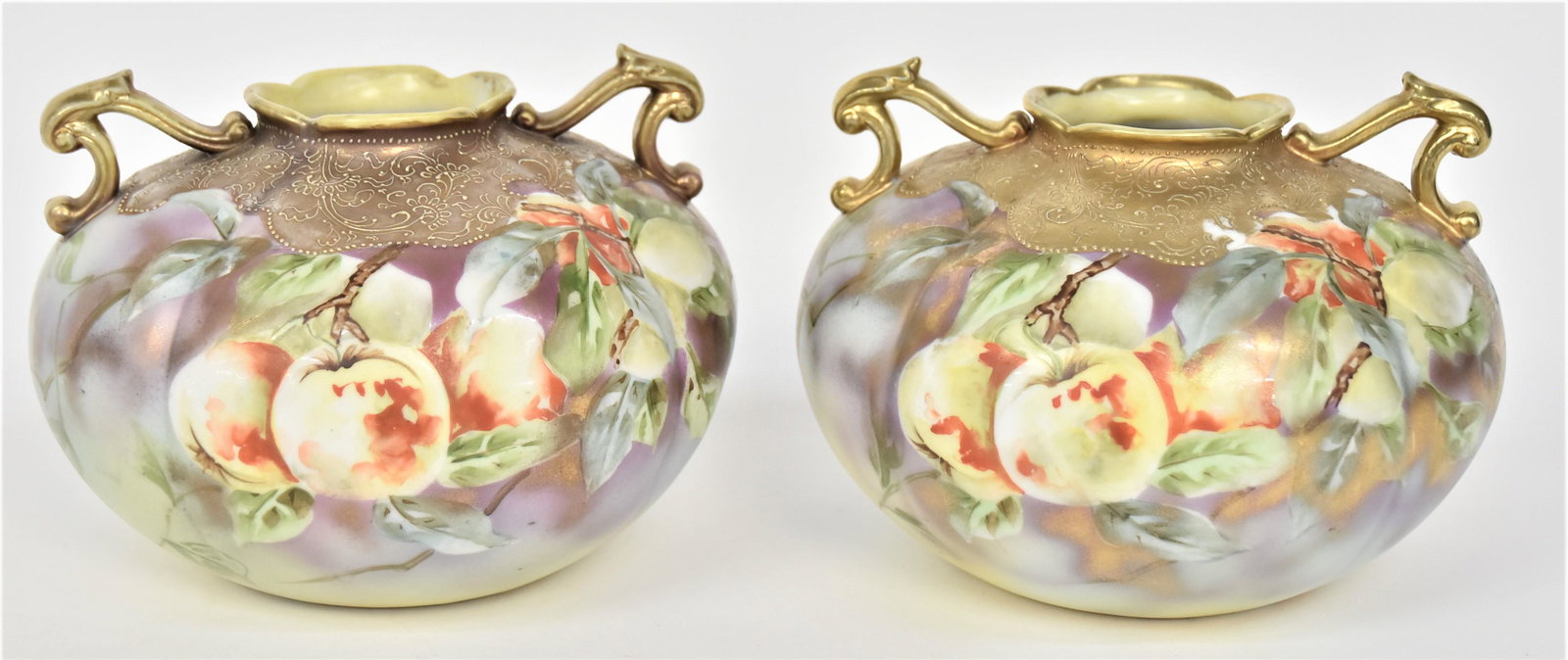 Pair Nippon Gold & Scroll Apple Blossom Vases: Golden scrolled handles. 5 1/2”T. 7 1/4”W. Very good condition. Blue mark to each.