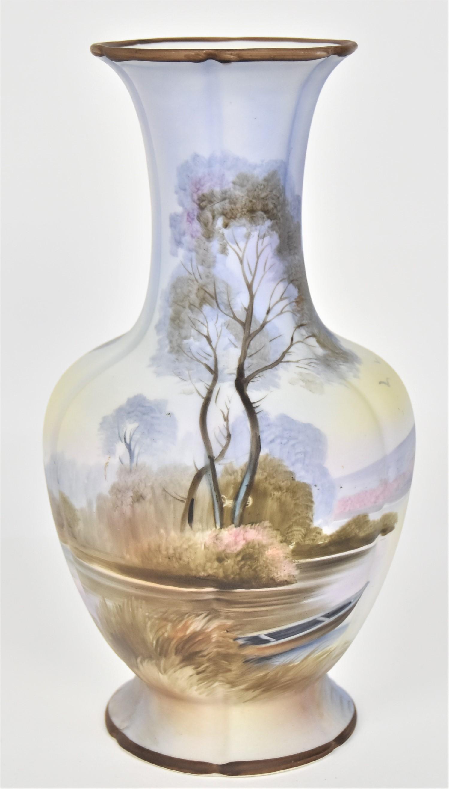 Nippon Fall Landscape Vase: With a canoe on the shore. 9 3/4”T. 5” W. Very good condition. Green mark.