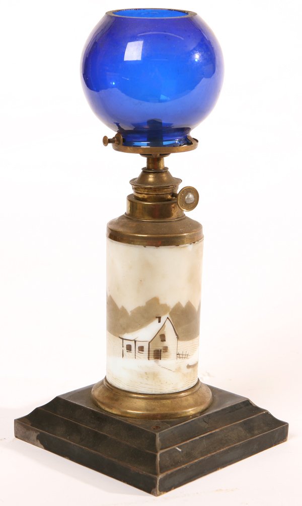 ANTIQUE COUNTER TOP CIGAR LIGHTER LAMP: Metal base with hand painted milk glass column and cobalt blue shade. Lacking brass tubes and lighters. 10 3/4" h.