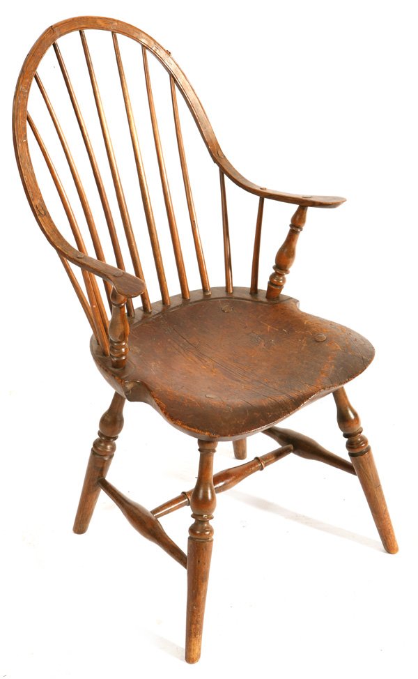 FINE PERIOD WINDSOR CONTINUOUS ARM CHAIR: Circa 1800 eleven spindle chair with mortised thru legs on saddle seat. Small crack at top, otherwise excellent condition with no added height. 36" h x 17 1/2" w x 18" d.
