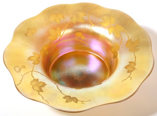 LG. TIFFANY GOLD FAVRILE INTAGLIO CUT BOWL: Wonderful large Tiffany gold favrile bowl with intaglio leaf and branch decoration. Signed "L.C. Tiffany Favrile" and numbered 1406. Also having original paper label. Excellent condition. 11 3/4" diam