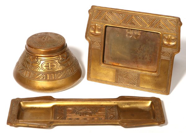 JENNINGS BROTHERS DESK SET: Tiffany Indian pattern. Bronzed over heavy metal inkwell with insert, frame and pen tray. Frame signed "JB 2201", Tray "JB 1856", inkwell is not signed. Lid is detached from inkwell. Light wear. Frame