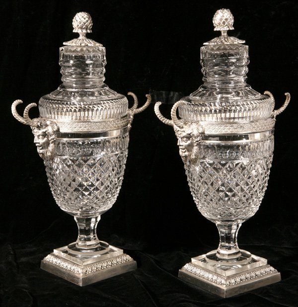 PR. OF CUT GLASS PAIRPOINT MOUNTED COVERED URNS: With silverplated mountings with pineapple lids and medieval horned mask handles. Marked "Pairpoint" on base. Good condition. 12 1/2" h.