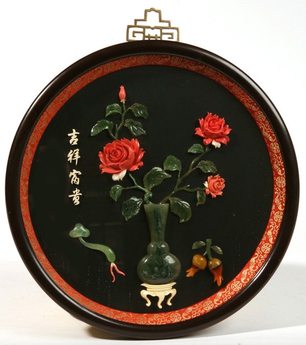 JADE CORAL & IVORY RELIEF PLAQUE: Chinese with green jade vase and leaves with stems, fruit on ivory stand and carved coral flowers. Carved ivory inscription. Fine condition. 12" diameter.