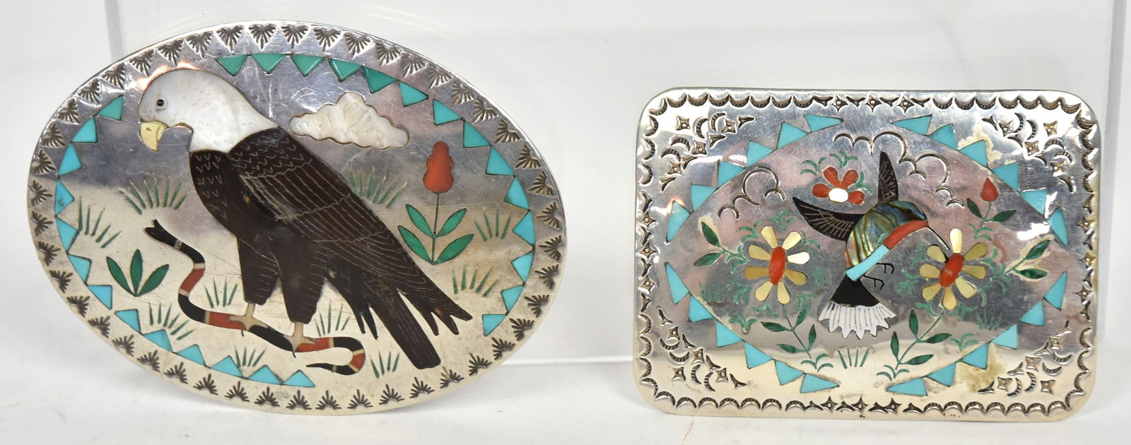 Two S&E Guardian Zuni Sterling Belt Buckles: Including oval example with balk eagle killing coral snake inlaid with jet, turquoise malachite, MOP & red coral, signed Sammy & Esther Guardian, Sterling, 3 1/4 x 2 1/2; and rectangular buckle with h