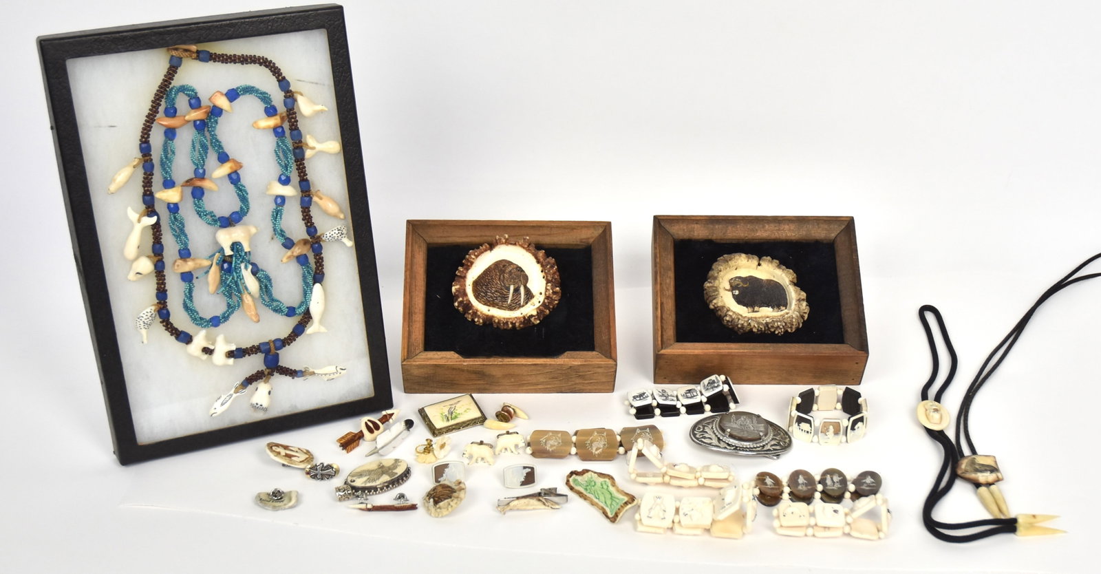 Inuit Jewelry: Lot of 28, including 7 carved bracelets; plus two pair of cuff links; plus two pair of earrings; plus ten broaches; plus one tie clasp; plus one fine beaded and carved bone necklace; plus two bolos, o