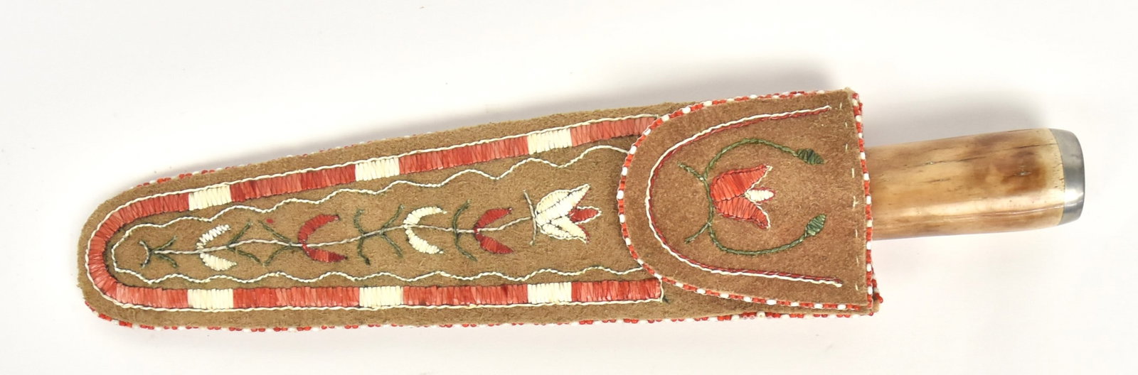 Quilled Knife Sheath with Knife: Lovely Anishinaabe floral quill work in red and white with beaded edging and embroidery details, on brown leather, circa last half of 20th century, 9 1/2" long with a smith made single edged knife wit