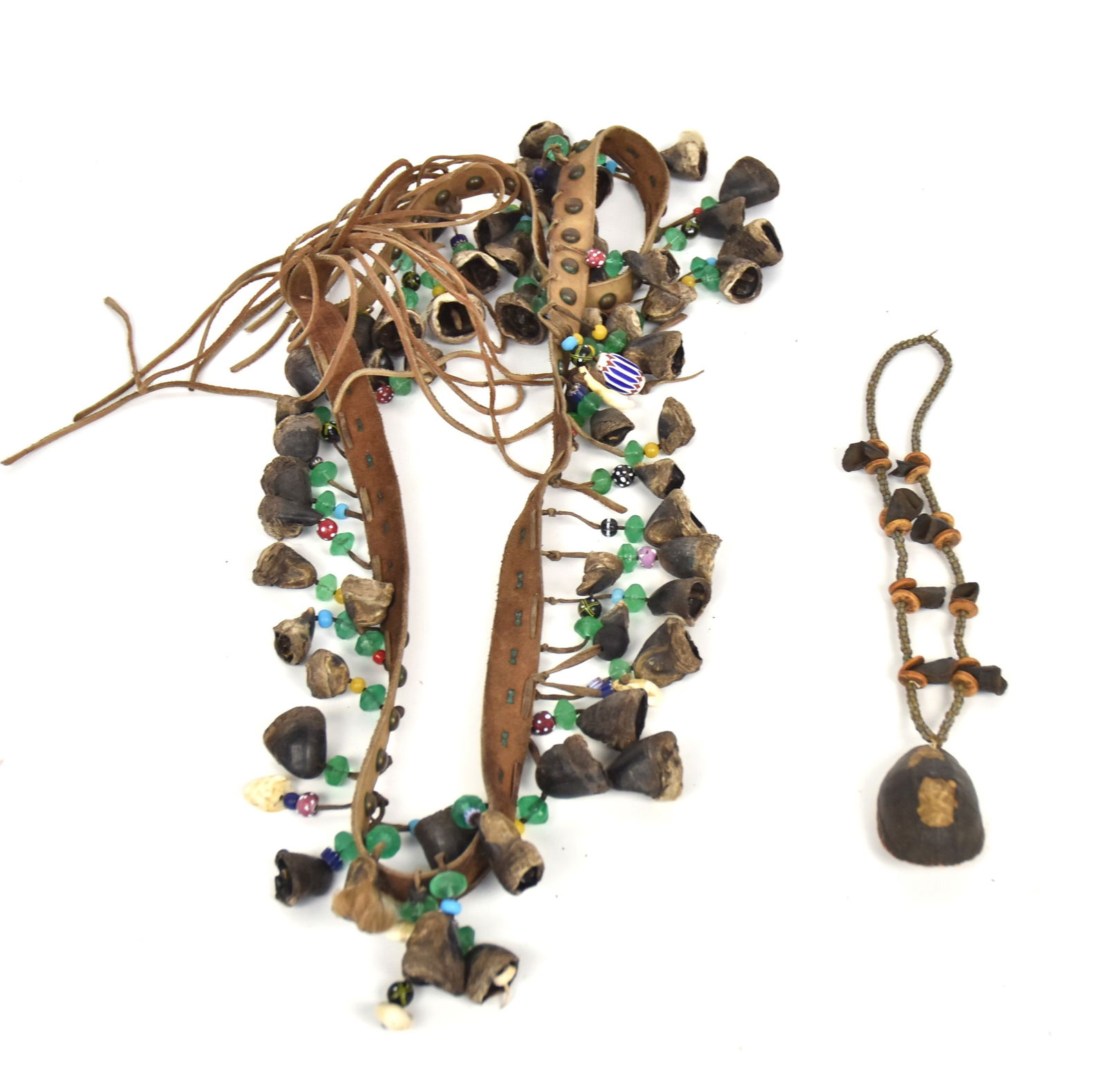 Dew Claw Dance Rattle Belt & Necklace: Lot of two including Great Lakes early 20th century necklace with glass & bone beads, deer dew claws and turtle shell pendant, 15" long; and mid 20th century leather dance belt with dew claws rattles