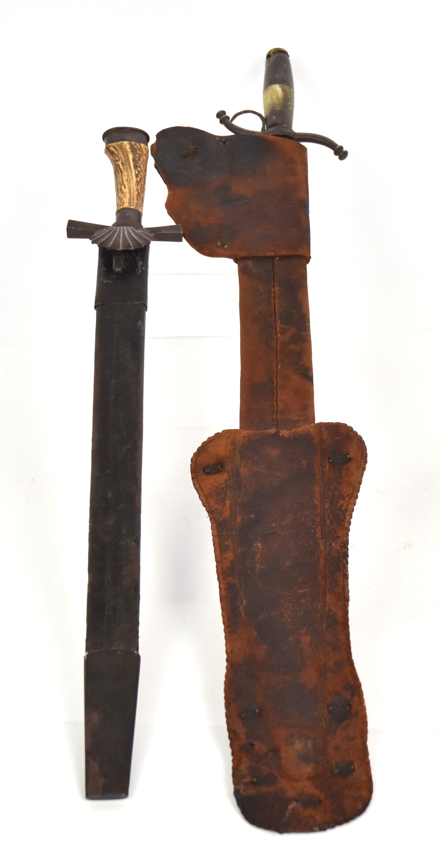 Two Short Swords: Including a nice German hunting sword with 18 3/4" clipped end blade, with cross guard with shell form langet, 3/4" steel collar and pommel with stag antler grip, total length 24", with black leather 