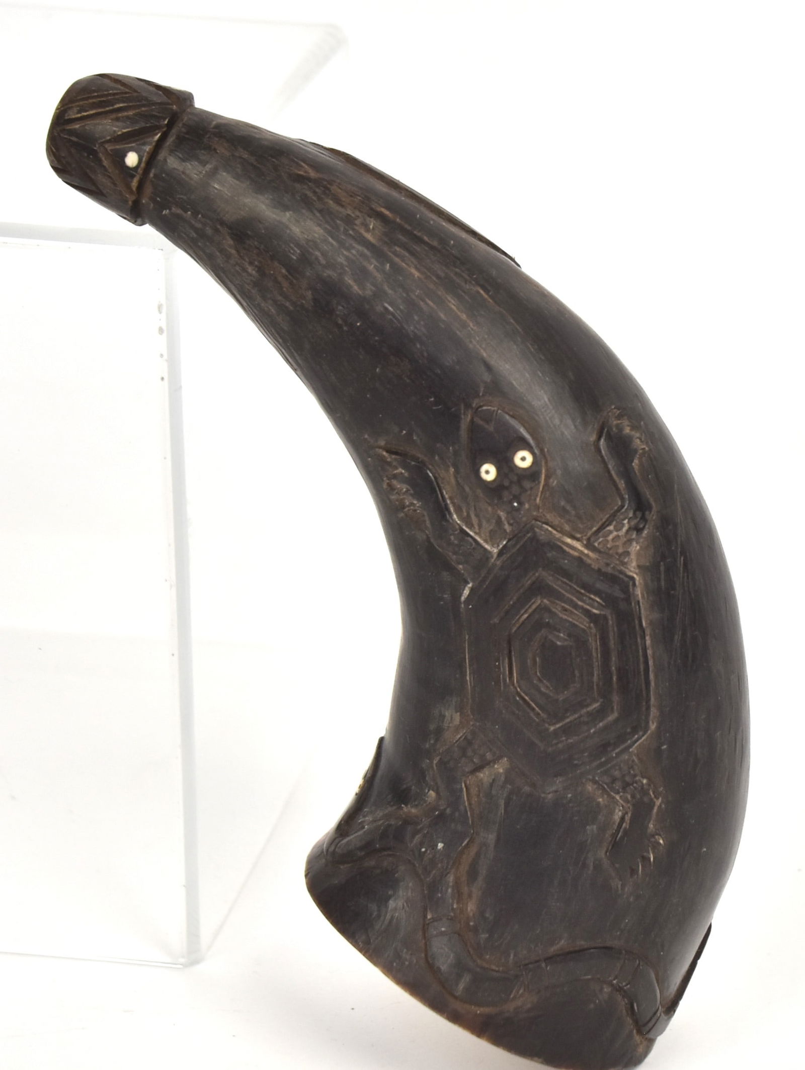 Plains Relief Carved Powder Horn: Likely Native American with carved bison horn with turtle, two snakes and leaping horse, all wit bone inset eyes, pine recessed wood plug, attached with leather wrap, 8" long