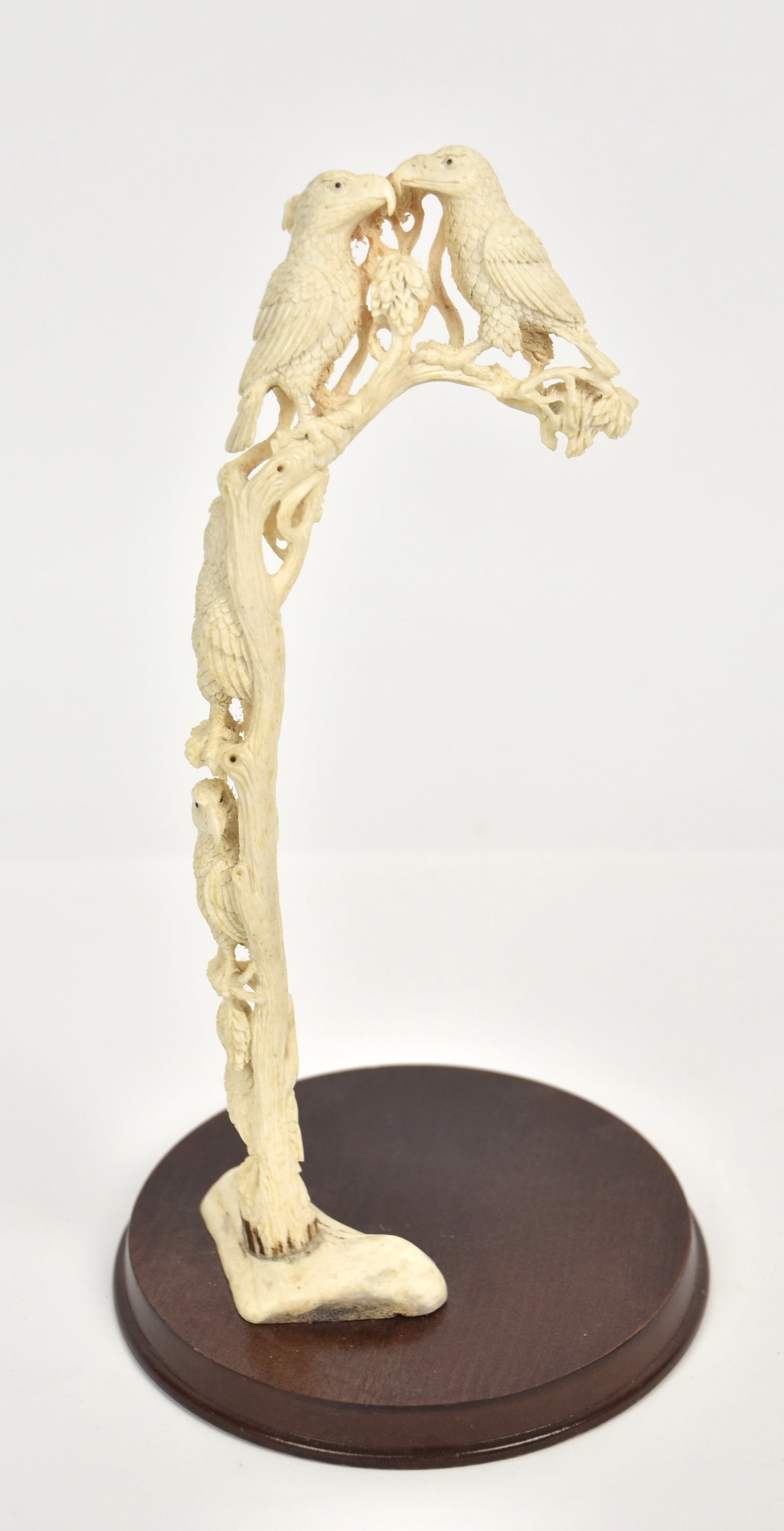 Outstanding Carved Antler Tree with Hawks: Branching tree with five hawks perched on various parts, on rosewood base, 6 1/2" diameter x 12 1/2" high. Condition Fine.
