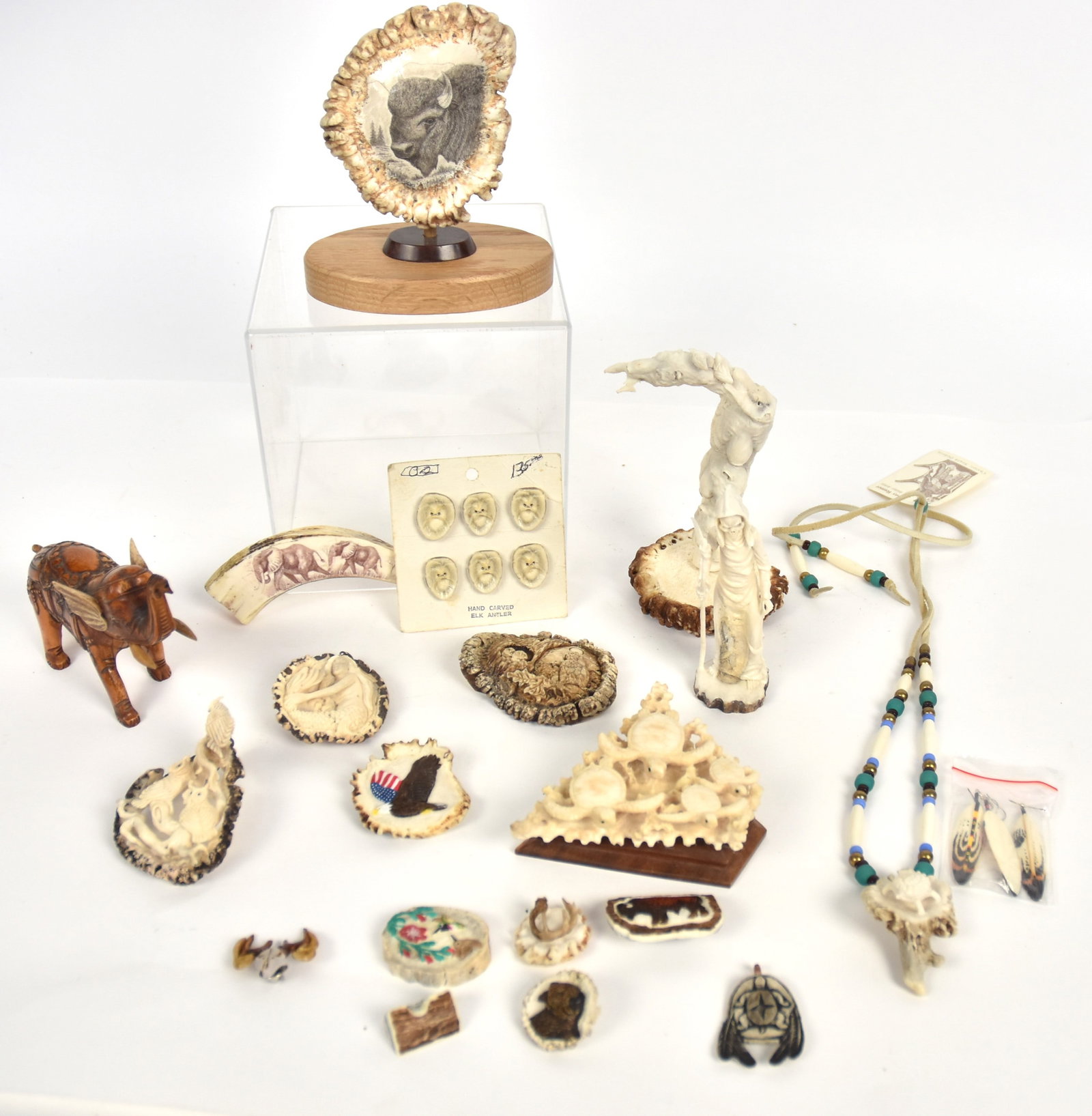 Beautiful Carved Antler Figures Plus: Lot of 21, 19 of which are antler carving including full standing skeletal Death in hooded cloak with scythe, 4 3/4" high, column of bears heads, 6 1/4" high; group of sea turtles on rosewood base, sw